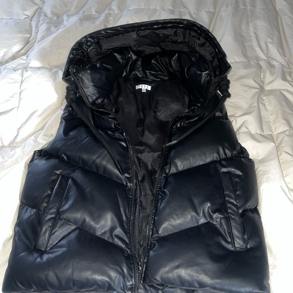 Black hooded puffer vest.